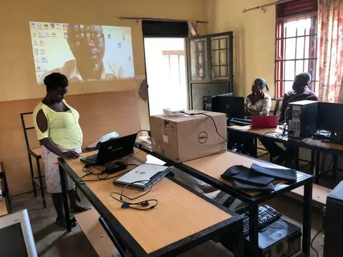 A participant presenting to the group during training
